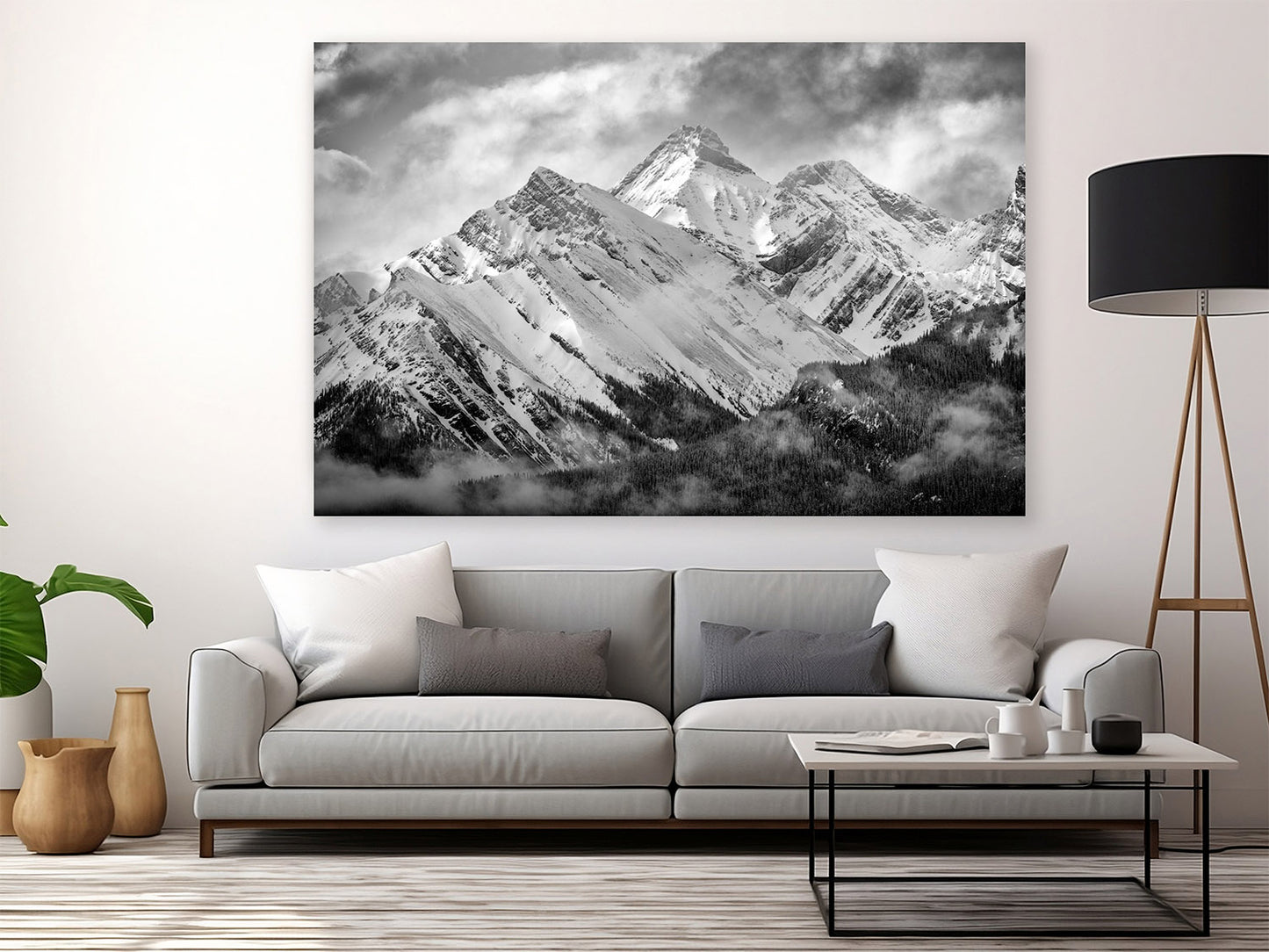 Living room with a large mountain landscape painting on the wall above a sofa. Misty Mountains, Mount Murray, Kananaskis Country, Alberta, Canada, Rocky Mountains