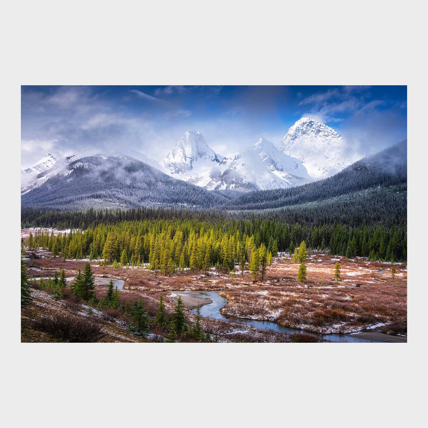Snow-capped mountains with a forest and a river in the foreground. Spray Valley, Kananaskis Country, Alberta, Canada, Rocky Mountains