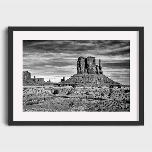 Framed black and white photograph of Monument Valley landscape