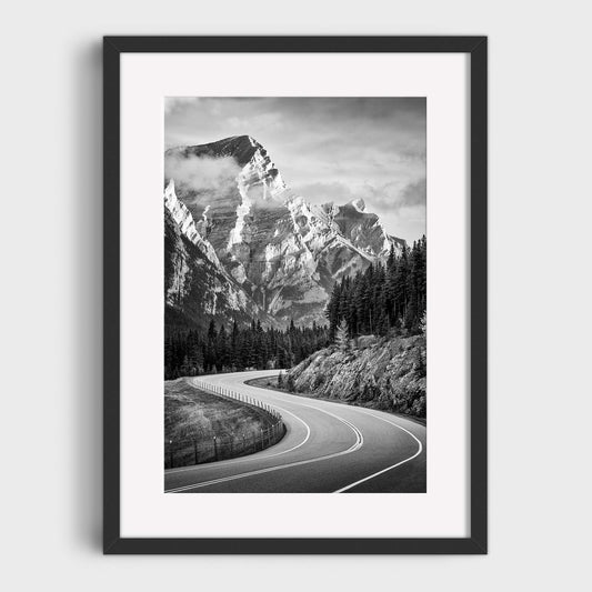 Framed black and white print of a mountain landscape with a winding road. Kananaskis Country, Fine Art Photography, Dermot O'Kane, Rocky Mountains, Alberta, Canada