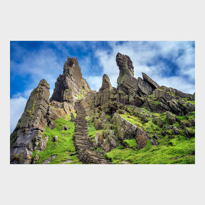 Rocky landscape with ancient stone steps leading up a grassy hill under a blue sky. Skellig Michael Steps, Co. Kerry, Ireland, Luke Skywalker, Star Wars Island