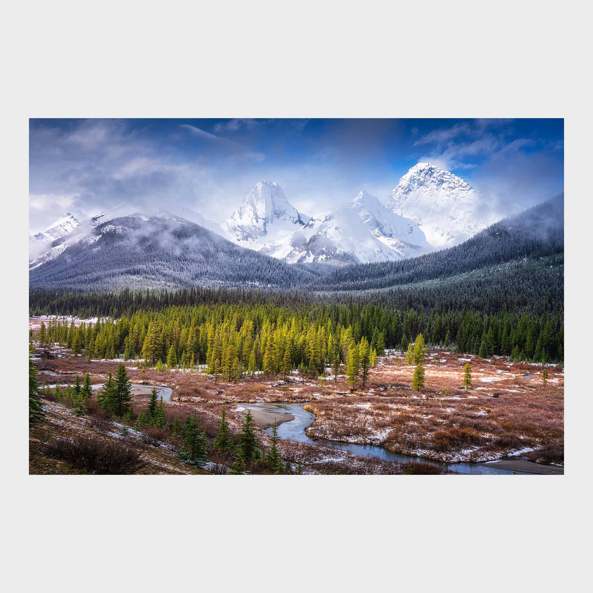 Snow-capped mountains with a forest and a river in the foreground. Spray Valley, Kananaskis Country, Alberta, Canada, Rocky Mountains