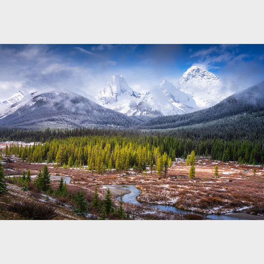 Snow-capped mountains with a forest and a river in the foreground. Kananaskis Country, Alberta, Canada, Canadian Rockies, Beautiful fine art landscape photography wall art limited edition prints for sale.